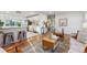 Bright living room with hardwood floors and mid-century modern furniture at 3307 Teller St, Wheat Ridge, CO 80033