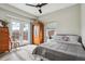 Comfortable bedroom featuring wood floors, a full bed, natural light, and closet at 3165 W 63Rd Ave, Denver, CO 80221