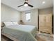 Cozy bedroom with a ceiling fan and a light-colored bed frame at 3165 W 63Rd Ave, Denver, CO 80221