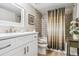 Bathroom with a shower-tub, vanity, and decorative shower curtain at 13961 E Marina Dr # 414, Aurora, CO 80014
