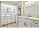 Elegant bathroom featuring dual sinks, white cabinetry, and modern fixtures, creating a luxurious space at 13961 E Marina Dr # 414, Aurora, CO 80014