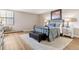 Cozy bedroom with a bed, bedside tables, lamps, and decorative area rug creating a relaxing space at 13961 E Marina Dr # 414, Aurora, CO 80014