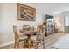 Cozy dining area with a round wooden table, chairs, and a cabinet, perfect for enjoying meals at 13961 E Marina Dr # 414, Aurora, CO 80014