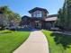 Attractive community building with stone accents, lush landscaping, and a welcoming entrance at 13961 E Marina Dr # 414, Aurora, CO 80014