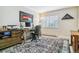 Comfortable home office with a wooden desk, office chair, and decorative area rug providing an efficient workspace at 13961 E Marina Dr # 414, Aurora, CO 80014