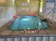 Relax in the community hot tub with clear water, tile surround, and convenient safety rails at 13961 E Marina Dr # 414, Aurora, CO 80014