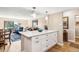 Bright kitchen island with white countertops and storage, seamlessly connected to the living area for open-concept living at 13961 E Marina Dr # 414, Aurora, CO 80014