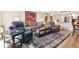 Inviting living room with hardwood floors, comfortable seating, a patterned rug, and stylish decor at 13961 E Marina Dr # 414, Aurora, CO 80014
