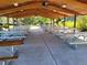 Covered picnic area with multiple tables and a ceiling fan for outdoor relaxation and community gatherings at 13961 E Marina Dr # 414, Aurora, CO 80014