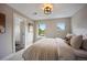 Bedroom with neutral walls, white linens, and two bright windows at 3690 W Byron Pl, Denver, CO 80211