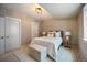 Comfortable bedroom features neutral tones, stylish furniture, and two doors at 3690 W Byron Pl, Denver, CO 80211