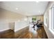 Spacious bonus room featuring hardwood floors, natural light, and access to outdoor deck at 3690 W Byron Pl, Denver, CO 80211