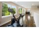 Spacious bonus room featuring hardwood floors, natural light, and kitchenette area at 3690 W Byron Pl, Denver, CO 80211