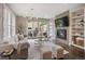 Cozy living room featuring a modern fireplace, stylish decor, and comfortable seating at 3690 W Byron Pl, Denver, CO 80211