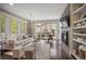 Elegant living room with modern fireplace, stylish furniture, and ample natural light at 3690 W Byron Pl, Denver, CO 80211