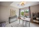 Comfortable office space with a large window, a modern desk, and minimalist decor at 3690 W Byron Pl, Denver, CO 80211
