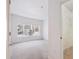 Spacious bedroom with large window and walk-in closet featuring wire shelving at 4875 S Balsam Way # 6-102, Littleton, CO 80123