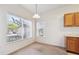 Cozy dining area features large windows offering natural light and scenic views, complemented by classic wood cabinetry at 4875 S Balsam Way # 6-102, Littleton, CO 80123