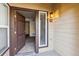Open doorway revealing a bright condo interior with tiled entry and view into the living space at 4875 S Balsam Way # 6-102, Littleton, CO 80123