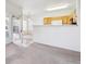 Spacious living room with a view of the kitchen, dining area, and outdoor access at 4875 S Balsam Way # 6-102, Littleton, CO 80123