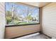 Covered patio overlooking landscaped green space and parking area, providing a private outdoor retreat at 4875 S Balsam Way # 6-102, Littleton, CO 80123