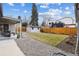 Spacious backyard featuring a patio, shed, and lush green lawn at 225 Niagara St, Denver, CO 80220