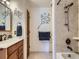 Bathroom featuring dual vanities and large walk-in shower at 7700 N Depew St # 1518, Arvada, CO 80003