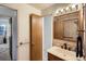Bathroom showcasing stylish mirror, vanity and fixtures at 7700 N Depew St # 1518, Arvada, CO 80003