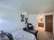 Bright bedroom featuring an en-suite bathroom and comfortable seating area at 7700 N Depew St # 1518, Arvada, CO 80003