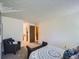 Bright bedroom featuring an accent chair and contemporary bench at 7700 N Depew St # 1518, Arvada, CO 80003
