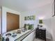 Comfortable bedroom featuring a full size bed and a large closet at 7700 N Depew St # 1518, Arvada, CO 80003