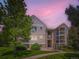 Exterior view of the property, landscaped with green grass and bushes at 7700 N Depew St # 1518, Arvada, CO 80003
