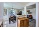 Dining area with a view to the outside, seamlessly connects to the living room creating an inviting open space at 7700 N Depew St # 1518, Arvada, CO 80003