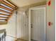 Close-up of a unit entrance door with a wooden staircase leading up to the next level at 7700 N Depew St # 1518, Arvada, CO 80003