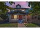 A beautiful two-story brick home with covered front porch, landscaping, and an inviting facade at 2854 Eliot St, Denver, CO 80211