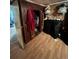Bedroom closet showcasing the interior of the closet space and laminate flooring at 2655 Pontiac St, Denver, CO 80207