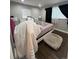 A simply decorated bedroom with a window and dark curtains at 2655 Pontiac St, Denver, CO 80207