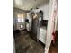 Functional kitchen area equipped with stainless steel appliances and sleek white cabinetry at 2655 Pontiac St, Denver, CO 80207