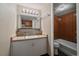 Bathroom with vanity, sink, and tiled shower/tub, creating a functional and comfortable space at 4801 E 9Th Ave # 108S, Denver, CO 80220