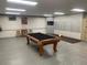 Billiards room featuring a well-maintained pool table, barstools, and a mail area at 4801 E 9Th Ave # 108S, Denver, CO 80220