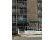 Building entrance with geometric design and covered awning, offering a unique and stylish welcome at 4801 E 9Th Ave # 108S, Denver, CO 80220