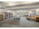 Community room offering a ping pong table, sofa, bar, and a bookcase for residents at 4801 E 9Th Ave # 108S, Denver, CO 80220