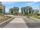 Exterior grounds with a walkway, a central pergola with seating and landscaped garden beds at 4801 E 9Th Ave # 108S, Denver, CO 80220