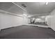 Spacious gym area featuring a mirrored wall, a staircase and fitness equipment at 4801 E 9Th Ave # 108S, Denver, CO 80220