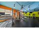 Open gym area with weight machines and a variety of cardio equipment under a blue ceiling at 4801 E 9Th Ave # 108S, Denver, CO 80220