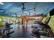 Well-lit gym area featuring treadmills, elliptical machines, and weightlifting equipment at 4801 E 9Th Ave # 108S, Denver, CO 80220
