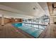 The bright indoor pool features tiled floors and ample natural light through many windows at 4801 E 9Th Ave # 108S, Denver, CO 80220