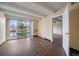 Bright living area with hardwood floors, sliding glass doors, and a neutral color scheme, showcasing modern living at 4801 E 9Th Ave # 108S, Denver, CO 80220