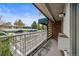 Open patio with a metal railing providing community views at 4801 E 9Th Ave # 108S, Denver, CO 80220