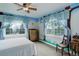 bedroom with a whimsical mural, carpet floors, and natural light from multiple windows at 31 N Algonquian St, Aurora, CO 80018